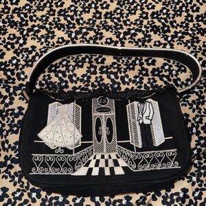 Lulu Guinness London storefront shop small black shoulder bag